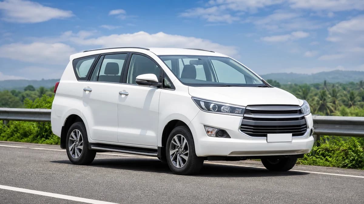 White 7-seater SUV or MUV for family trip rental enquiries